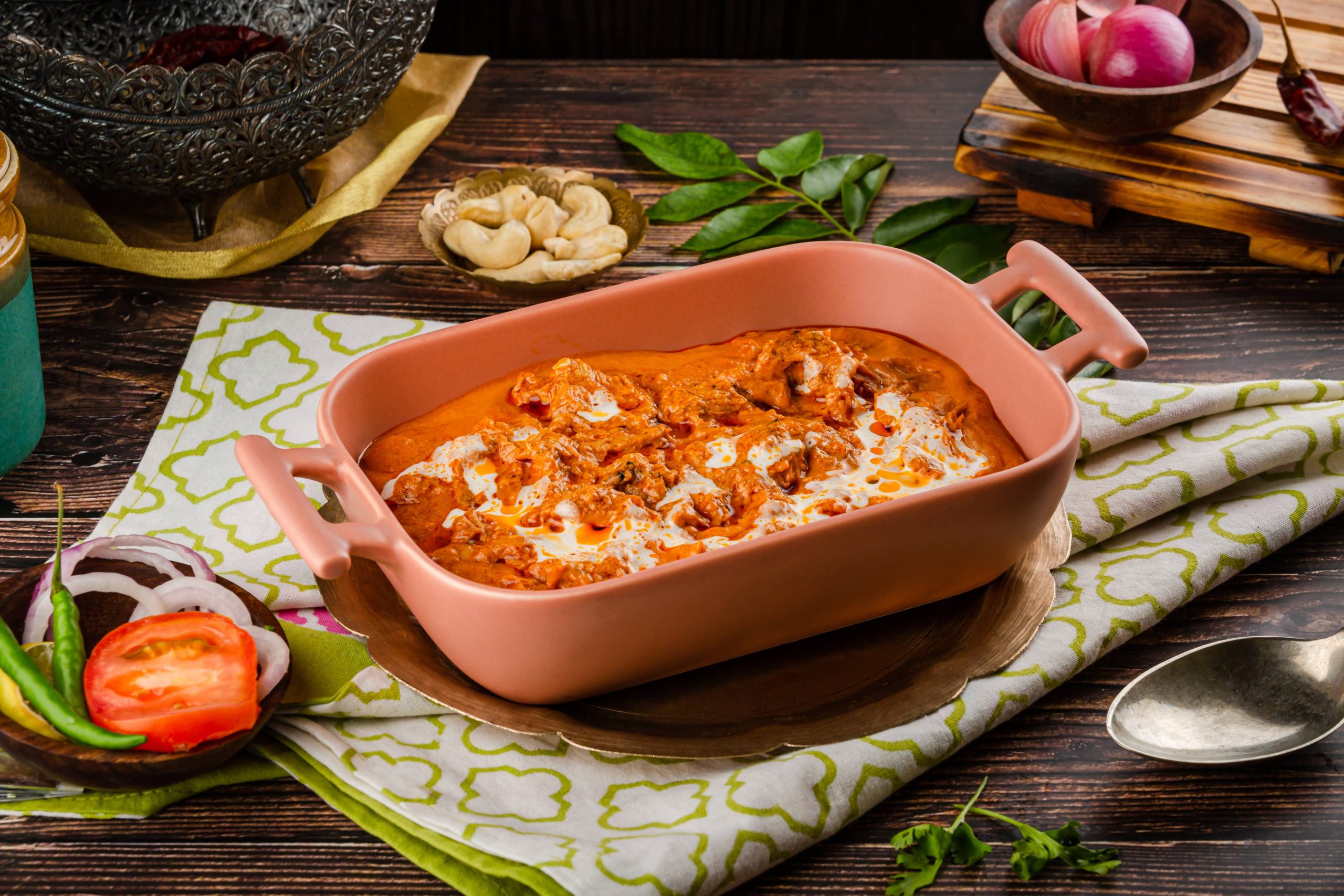 Butter chicken in peach ceramic tray – food photography Mumbai.