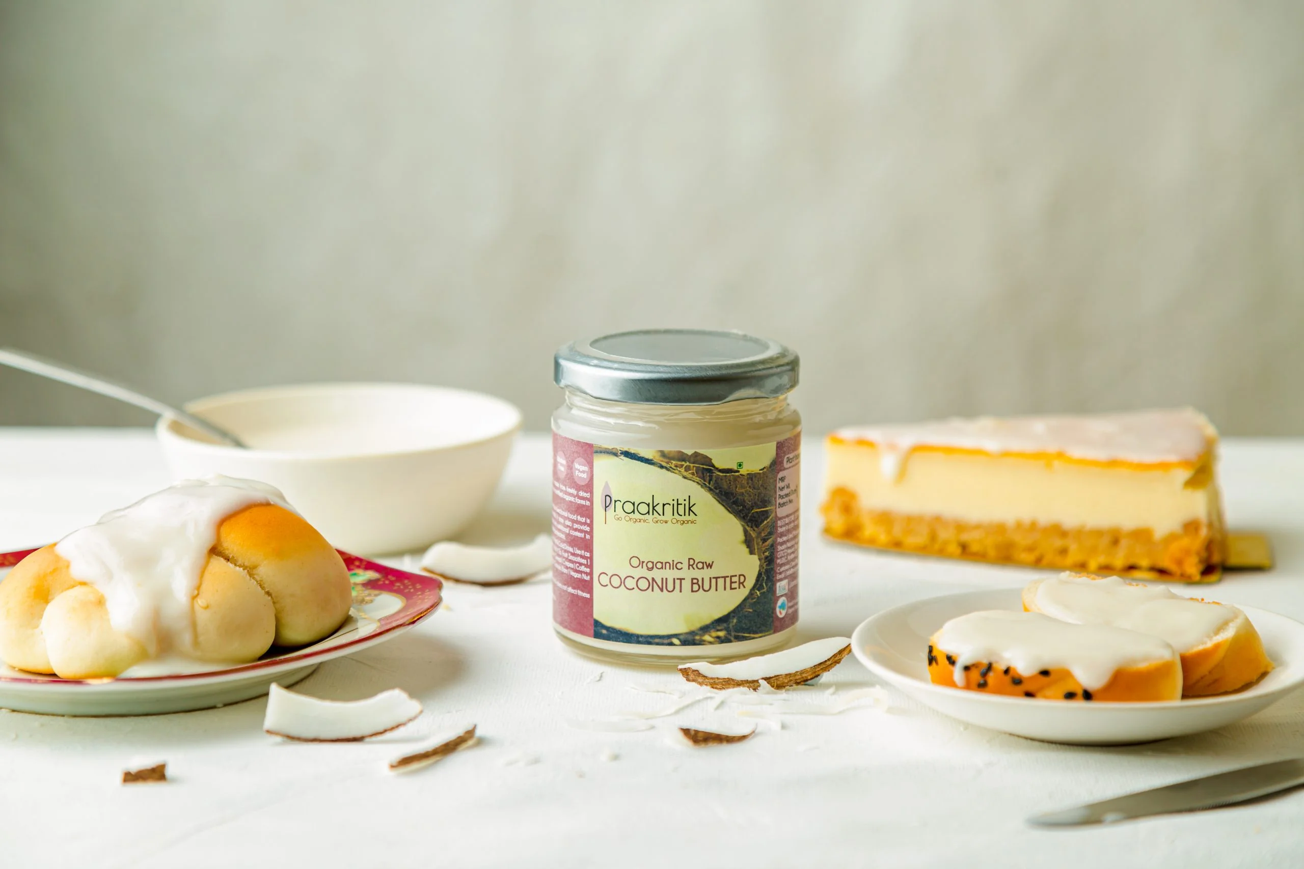 Organic coconut butter jar surrounded by dessert items – food photography Mumbai.