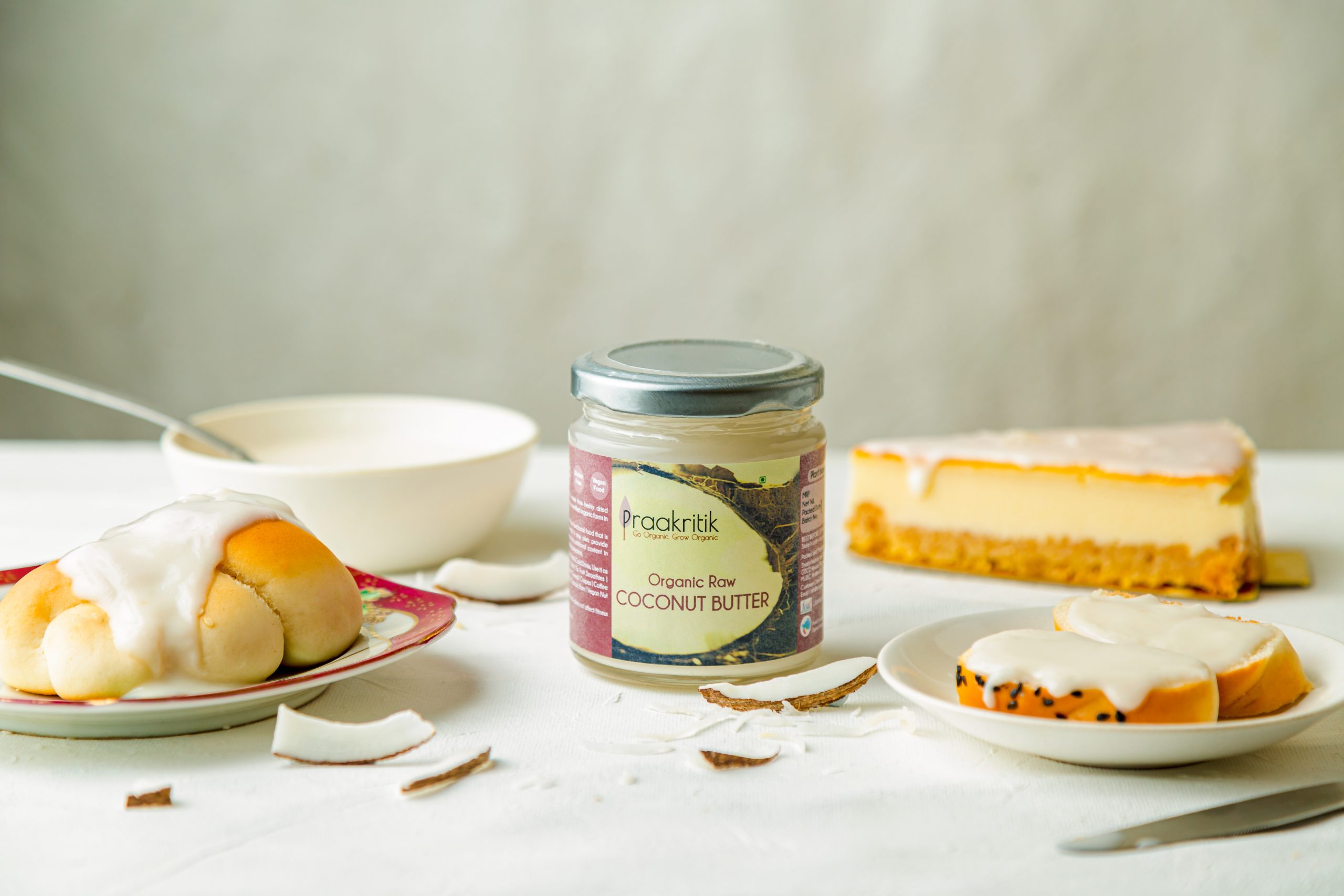 Organic coconut butter jar surrounded by dessert items – food photography Mumbai.
