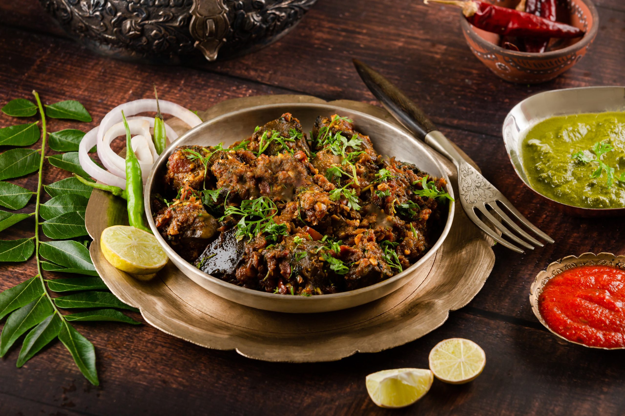 Traditional mutton curry with chutneys – Indian food photography Mumbai.