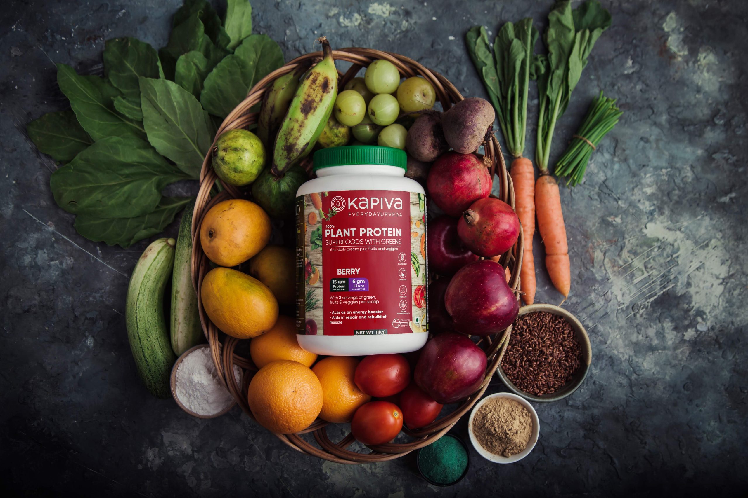 Kapiva protein powder flatlay with vibrant fruits – food photography Mumbai.