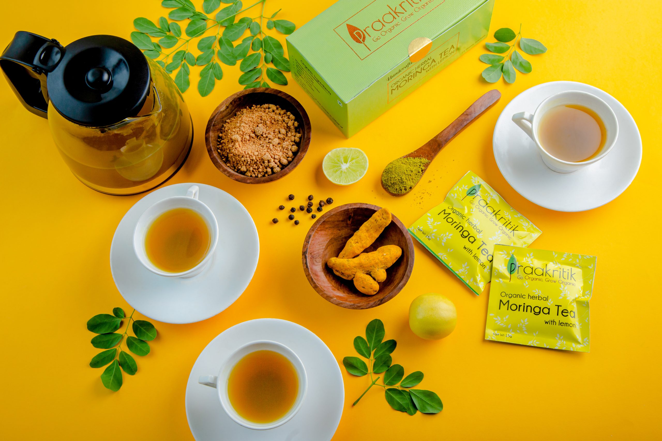 Top view of Moringa tea ingredients and teacups – flatlay photography Mumbai.
