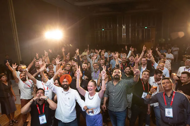 Crowd energy during corporate event recap coverage