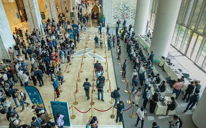 KubeCon registration hall and delegate scale