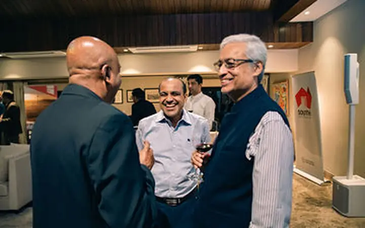 Senior convention guests networking in conversation