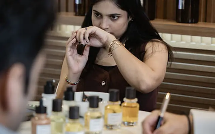 Trade Show Photographer Mumbai Mumbai Photography Visitor testing an Argeville product at CosmoHome Delhi