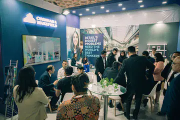 Corporate exhibition booth with visitors