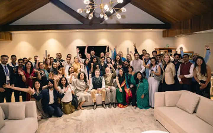 Celebratory full-room group moment
