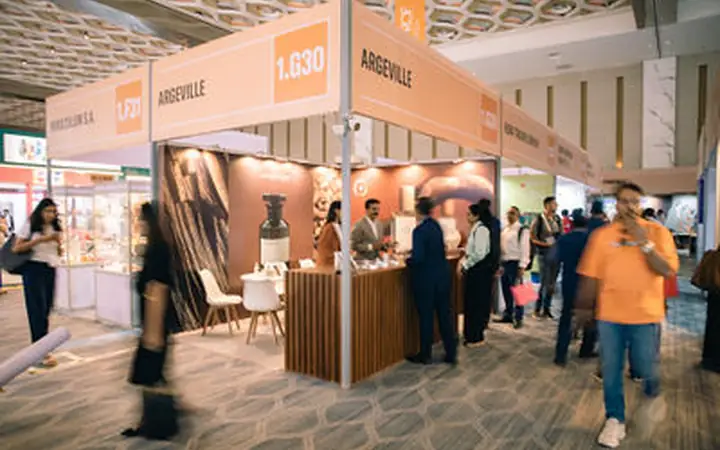 NESCO Bombay Exhibition Centre Trade Show Photography Cosmoprof aisle with multiple stands and visitors