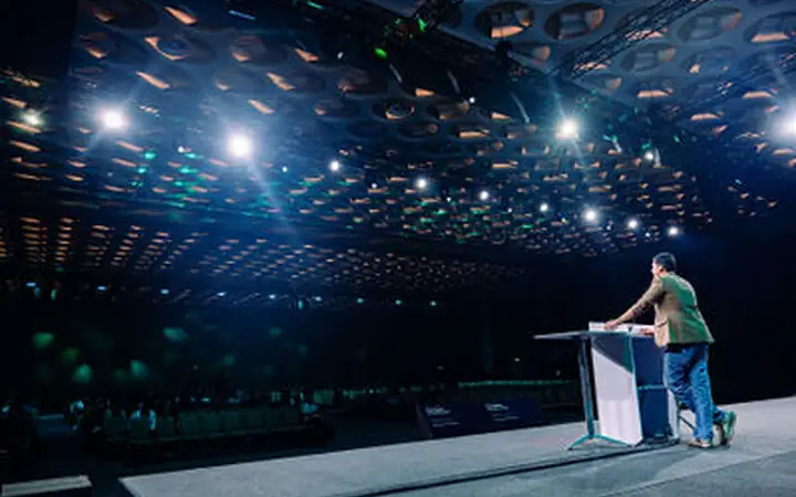Summit Photography and Videography Mumbai Speaker presenting with authority on the main stage